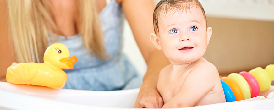 Baby Having Bath in Childproofed Bathroom