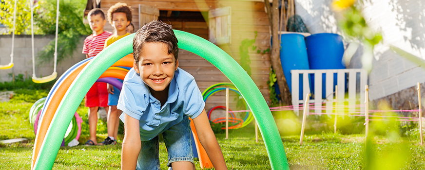 Child Crawling Through Obstacle Course at Home