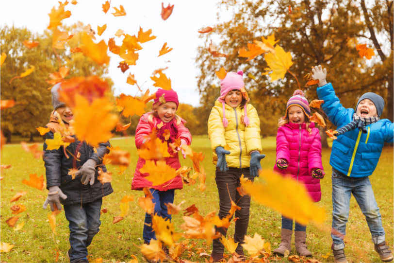 Kids playing in leaves