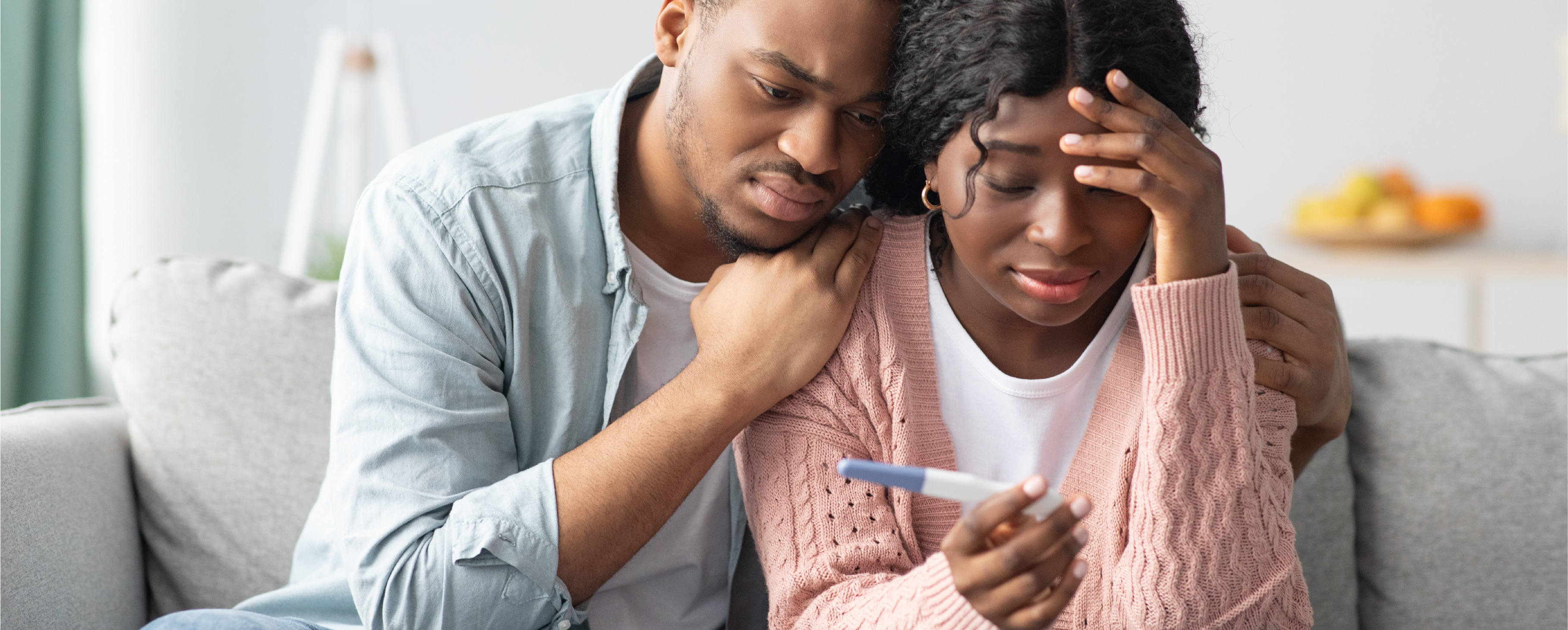 Couple Consoling Each Other After Negative Pregnancy Test