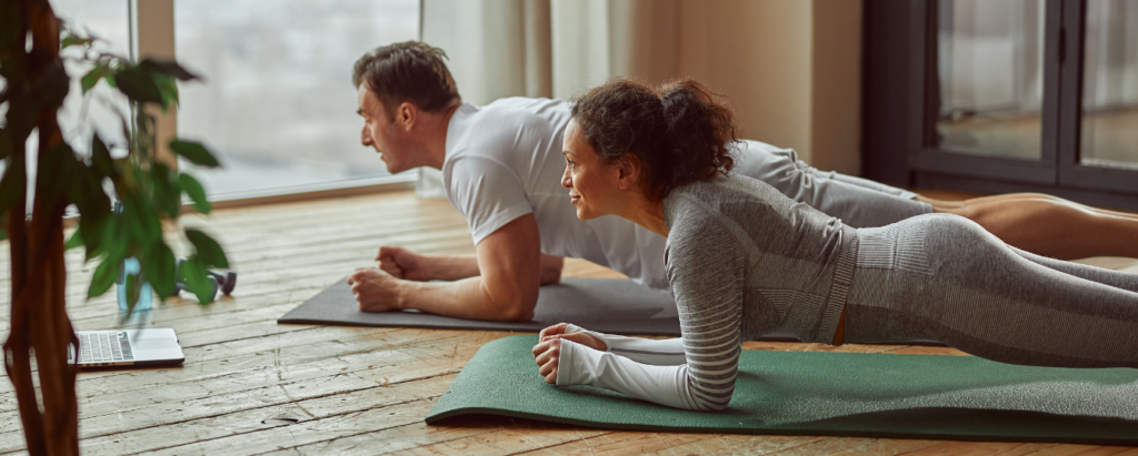 Couple Practicing Yoga to Reduce Stress for Fertility