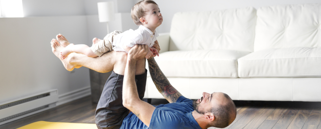 Father Doing Yoga for a Dad Workout with Baby