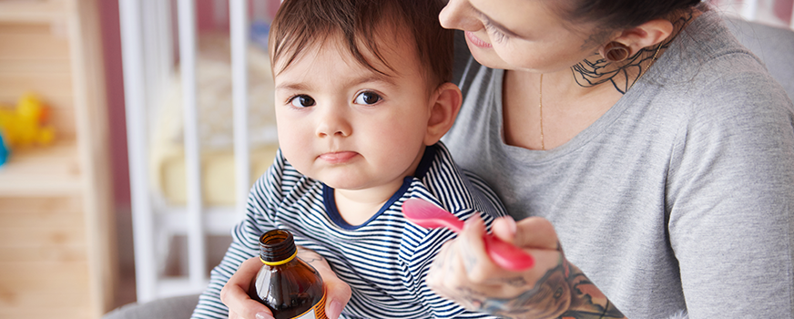Mother Giving Sick Baby Medications