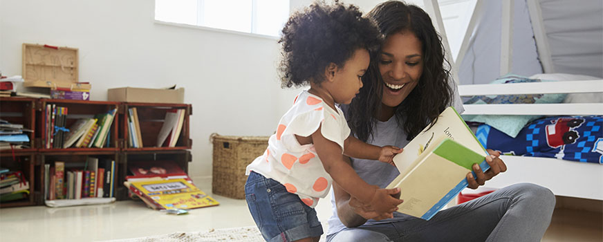 Mother Reading Potty Training Book with Toddler