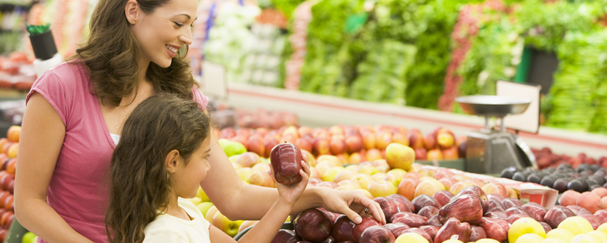 Mother and Daughter Shopping for Organic Produce