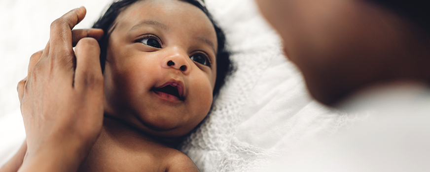 Newborn Looking at Mother Postpartum