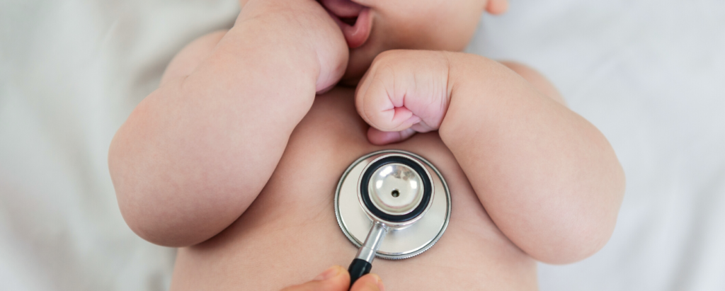 Pediatrician Using Stethoscope on Newborn Baby