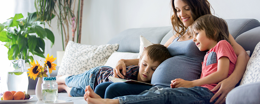 Pregnant Woman Relaxing with Children