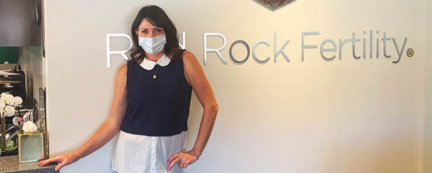 Red Rock team member at the front desk wearing a mask
