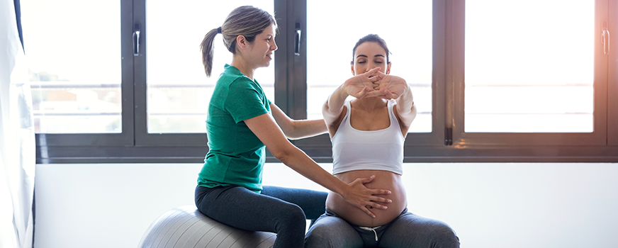 Woman with Personal Trainer for Pregnancy Workouts