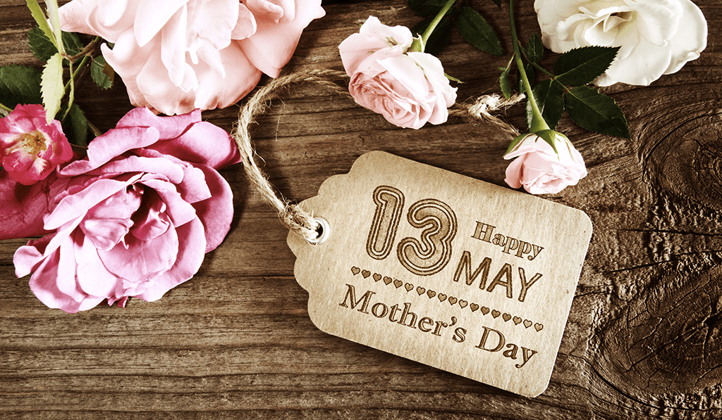 Flowers and tag that represent Mother’s Day, May 13th.